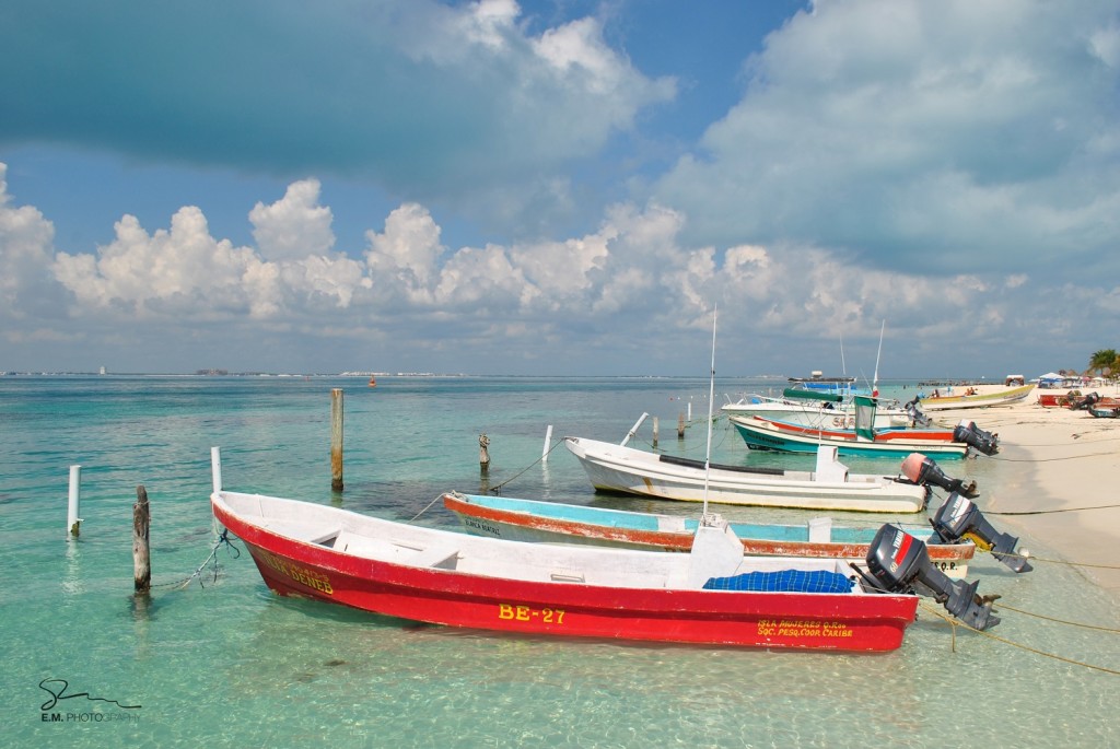 small fishing boats on playa sol isla mujeres